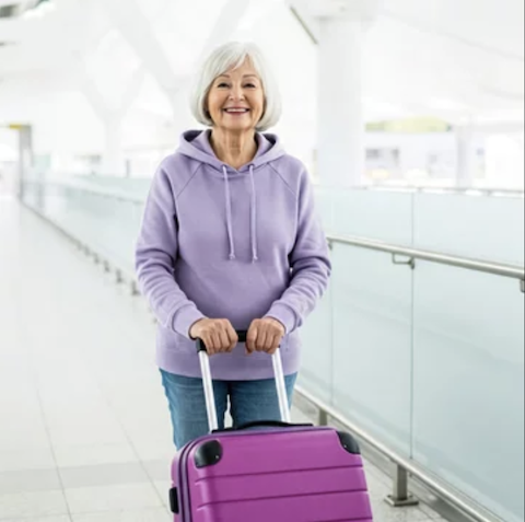 Lady at airport in purple