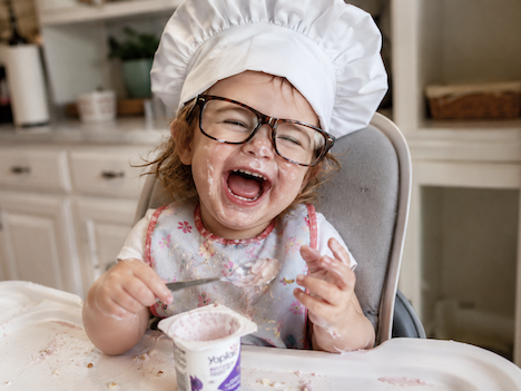 Kid yogurt laughing